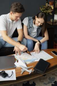 medium-shot-people-planning-trip-with-map Evidentrust Financial Services Ltd | Structuring Relocation Advisory